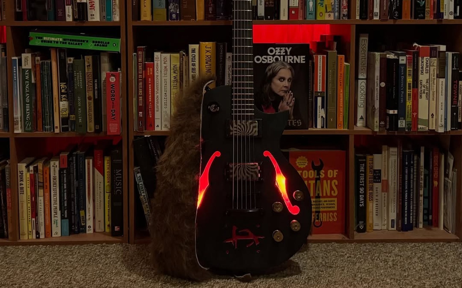 Bill Antonitis's finished baritone guitar, body centered, with its f-holes lit red from inside