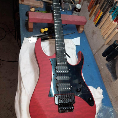 Customer-built red quilted maple JE-style guitar kit with Floyd Rose bridge — a completed DIY guitar kit build from Guitar Kit World