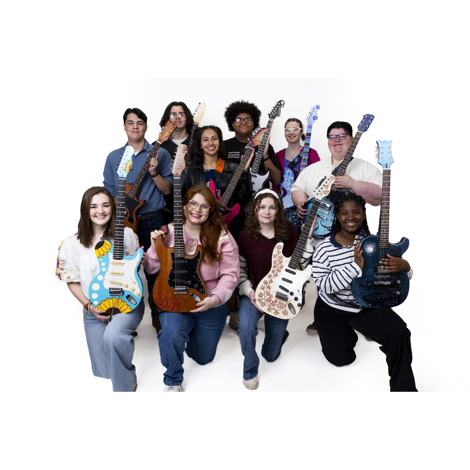 Ten Southern Arkansas University students with the electric guitars they built from blank kits