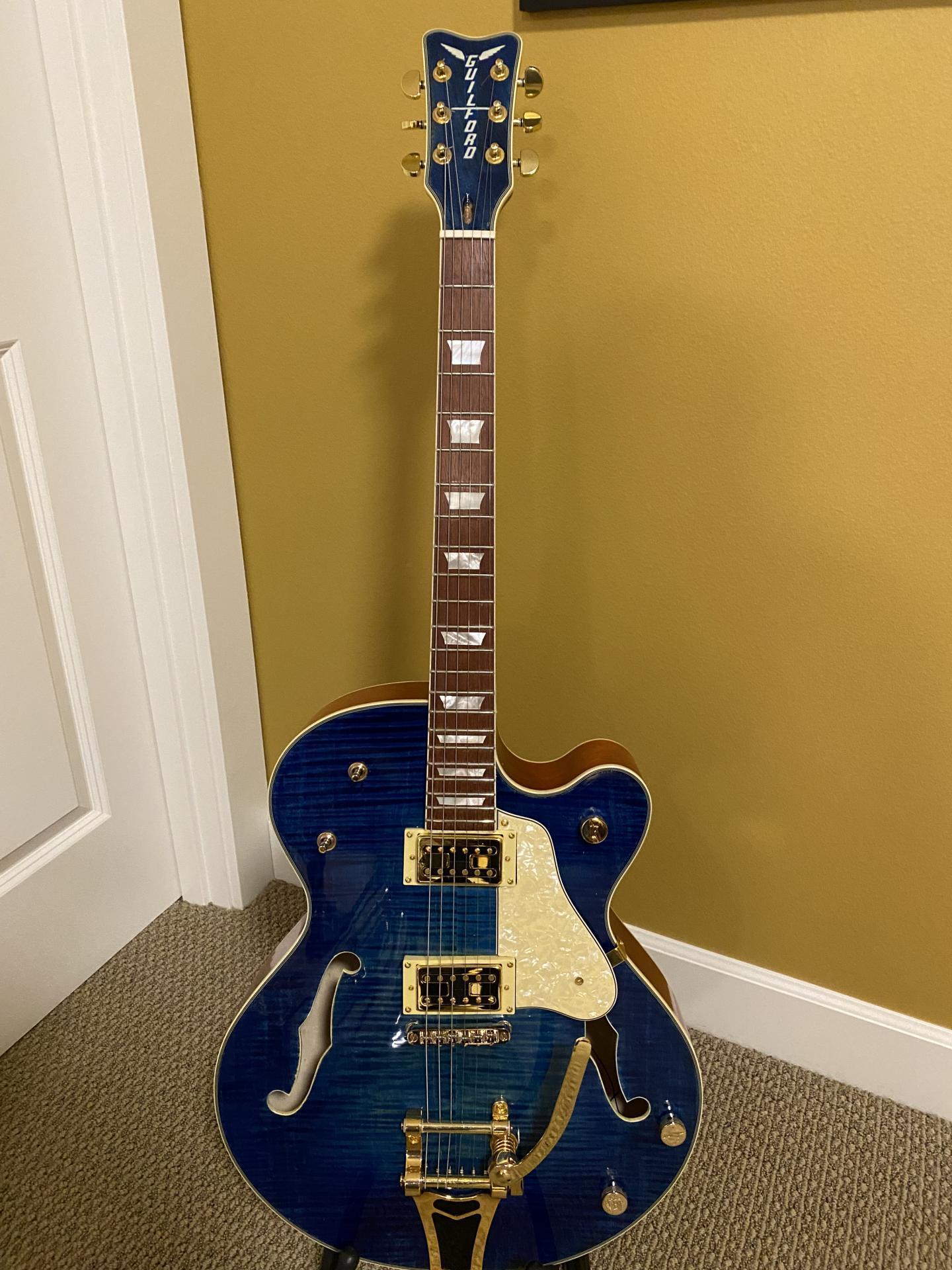 Hollow body archtop guitar kit finished in a blue burst, built by community member Guilford P.