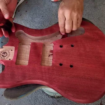 DIY offset-style guitar body being stained by builder Sean Jollie — Guitar Kit World