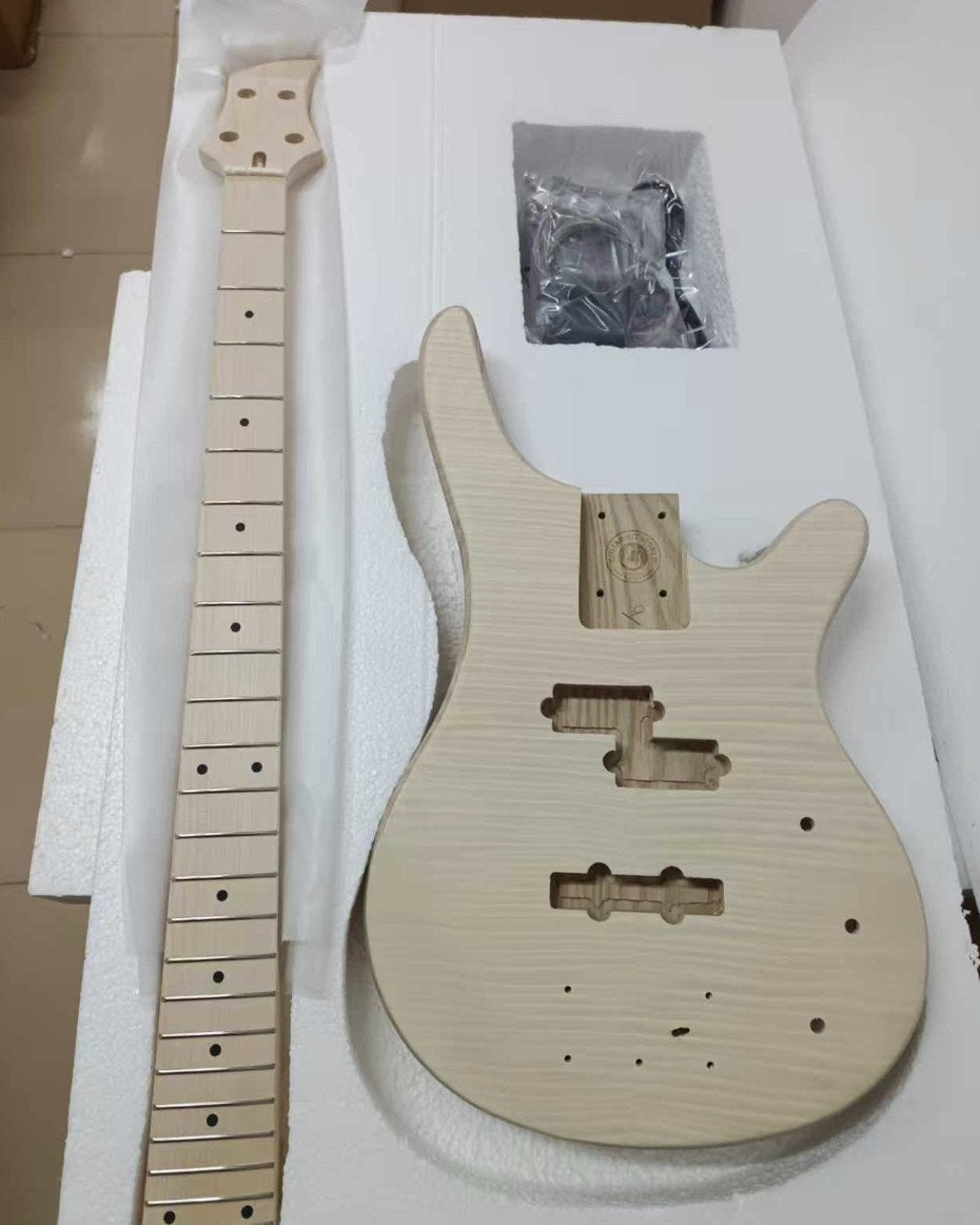 Unfinished bass kit body with flamed maple veneer top and routed P and J pickup cavities, beside a bare maple neck