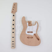 Maple fretboard bass neck with black block inlays next to the mahogany body