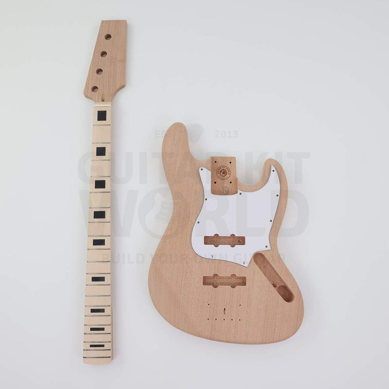 Maple fretboard bass neck with black block inlays next to the mahogany body