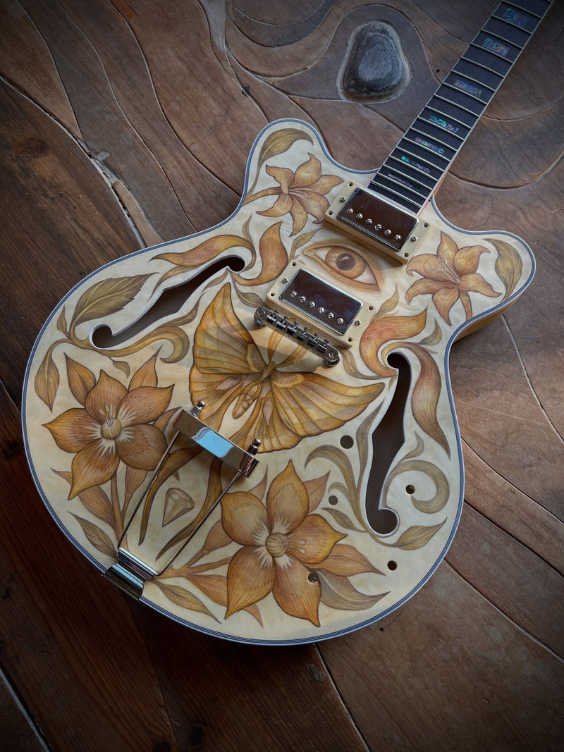 Assembled guitar with drawn top, fitted neck and inlaid fretboard