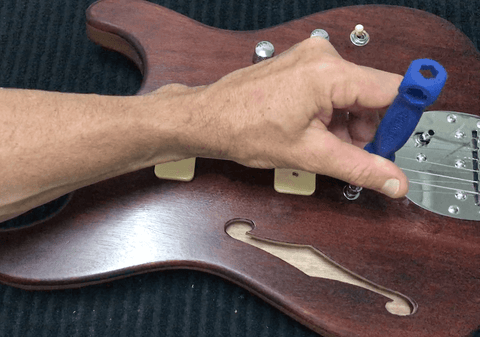 adjusting the action on the bridge