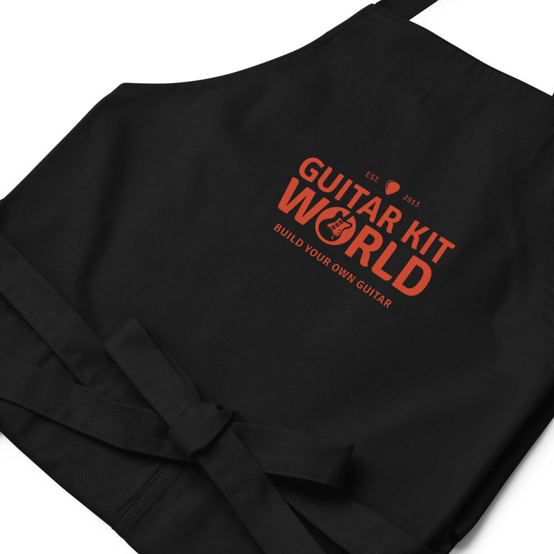 Sawdust and Solder Shop Apron, printed organic, close-up of the orange logo
