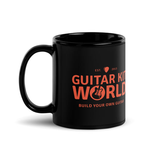 Builder's Coffee Mug, 11 oz, all black with an orange Guitar Kit World logo, handle on the left, the logo is on both sides