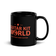 Builder's Coffee Mug, 11 oz, all black with an orange Guitar Kit World logo, handle on the right