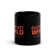 Builder's Coffee Mug, 11 oz, all black with an orange Guitar Kit World logo, logo wrap, center view