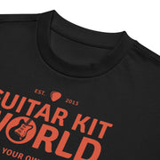 Black Properly Grounded Heavyweight Tee, orange Guitar Kit World logo, close-up of the print