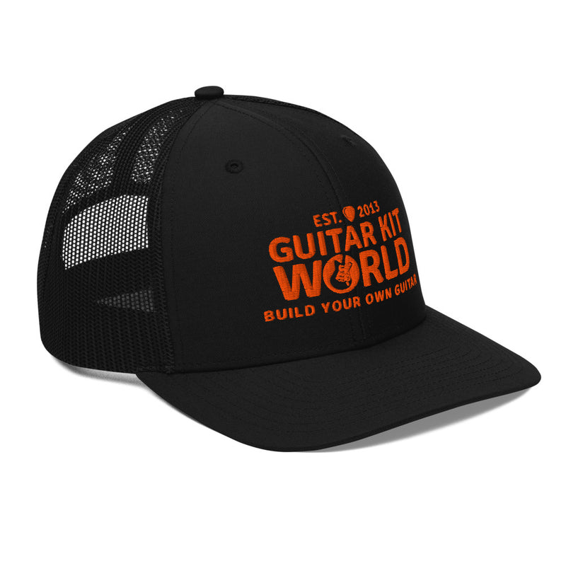 All black Workbench Trucker Hat, orange stitched Guitar Kit World logo, three-quarter view