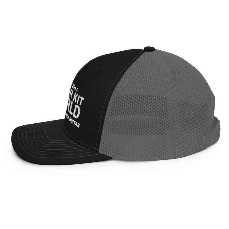 Black and charcoal Workbench Trucker Hat, white stitched Guitar Kit World logo, side view