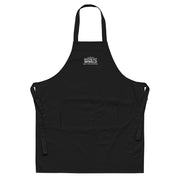 Black embroidered Sawdust and Solder Shop Apron with a white stitched Guitar Kit World logo, front view
