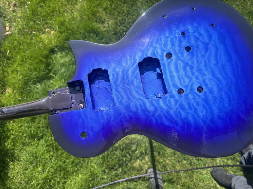 Gloss clear coat on the blue burst top photographed in raking daylight