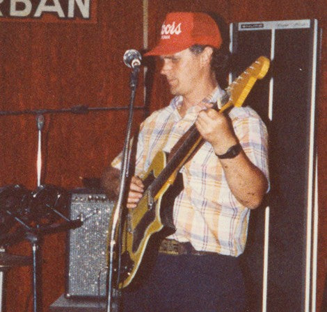 Byron Stafford onstage in 1978 playing the yellow guitar he scratch-built himself