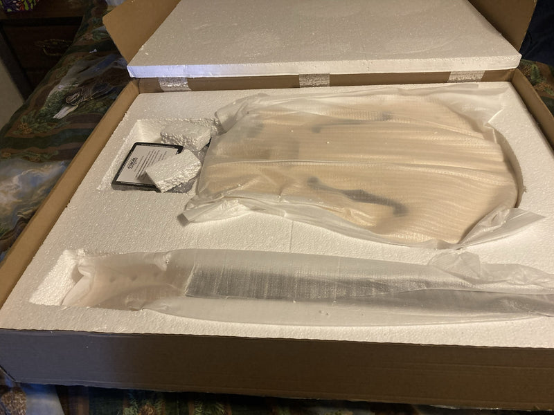 Guitar kit parts still sealed in plastic bags inside their foam packing tray