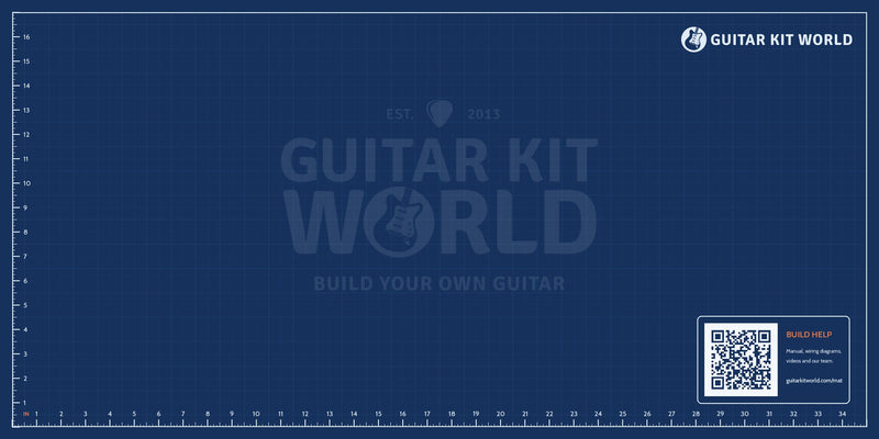 Full design of the Guitar Kit World build mat: inch grid, rulers, faint logo and build help QR code