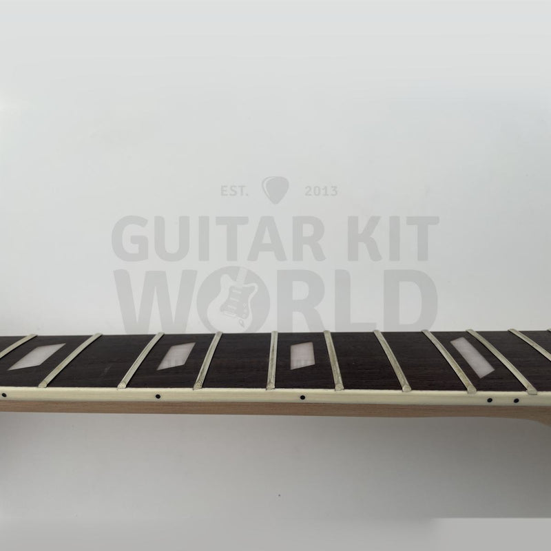 Close-up of pearl white parallelogram inlays on the flamed maple kit neck - Guitar Kit World