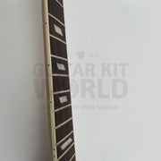 Close-up of pearl white parallelogram inlays on the rosewood fretboard - Guitar Kit World