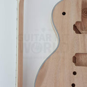 Close-up of multi-ply ivory body binding and bound neck edge