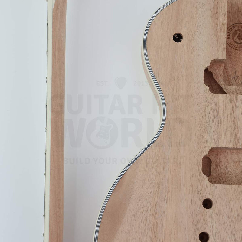Close-up of multi-ply ivory body binding and bound neck edge