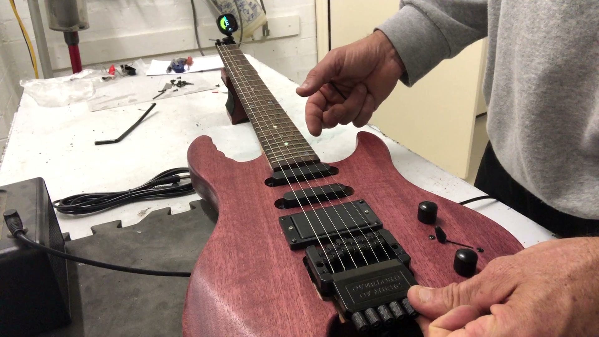 Finished headless electric guitar kit build, stained mahogany body with HSS pickups and a headless tremolo bridge
