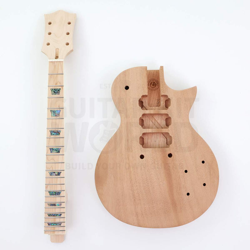 Mahogany body and maple neck with abalone pearloid trapezoid inlays