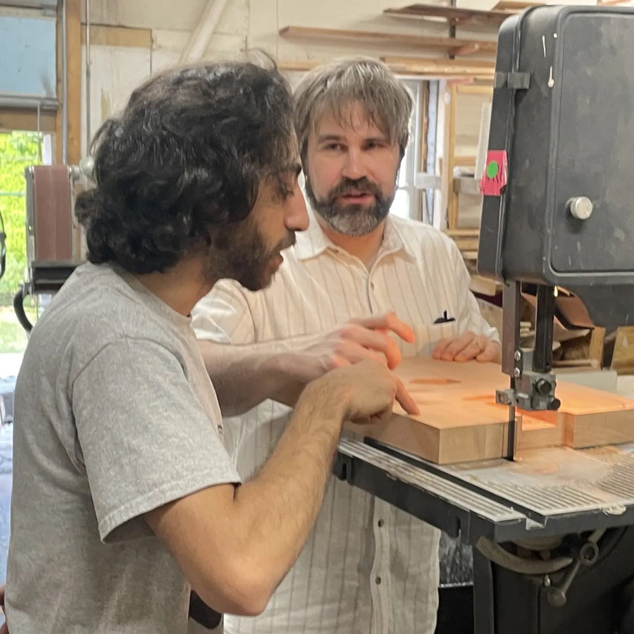 Shaping a guitar body on the bandsaw at the Baltimore guitar building workshop