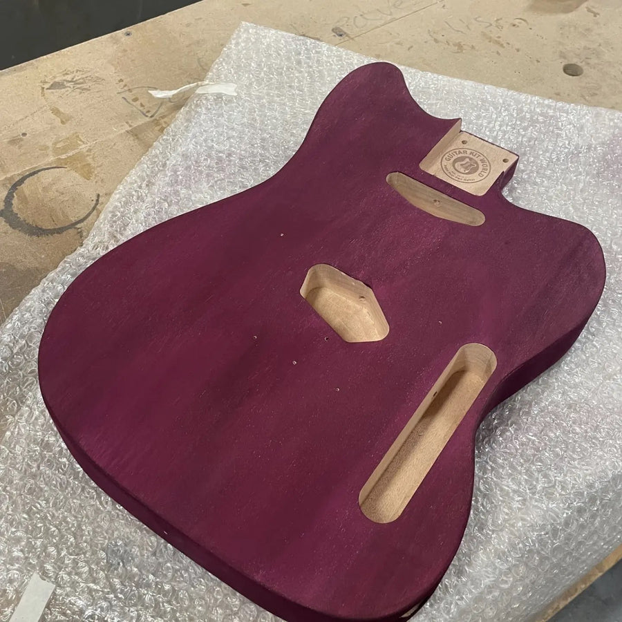 T-style guitar body in a deep purple stain at the Baltimore guitar building workshop